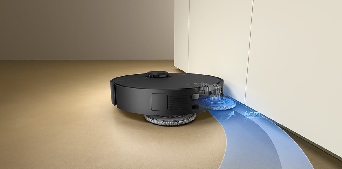 Robot sprzątający Dreame czyści podłogę przy krawędziach białej szafki